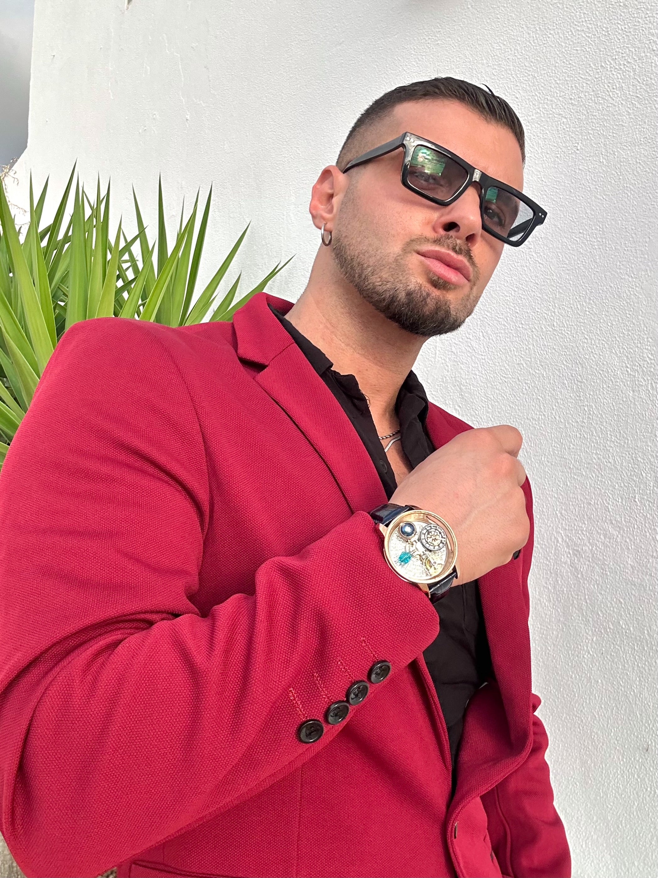 Antonio Diurno wearing a GEYA watch with a red jacket