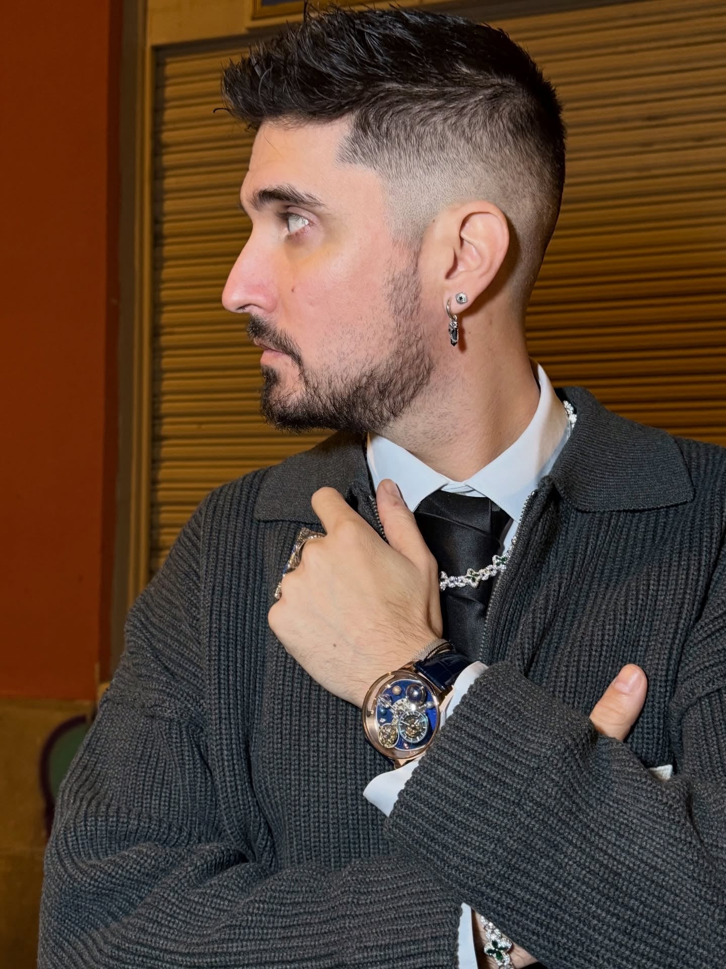 PF Pedro wearing a GEYA watch with a grey suit