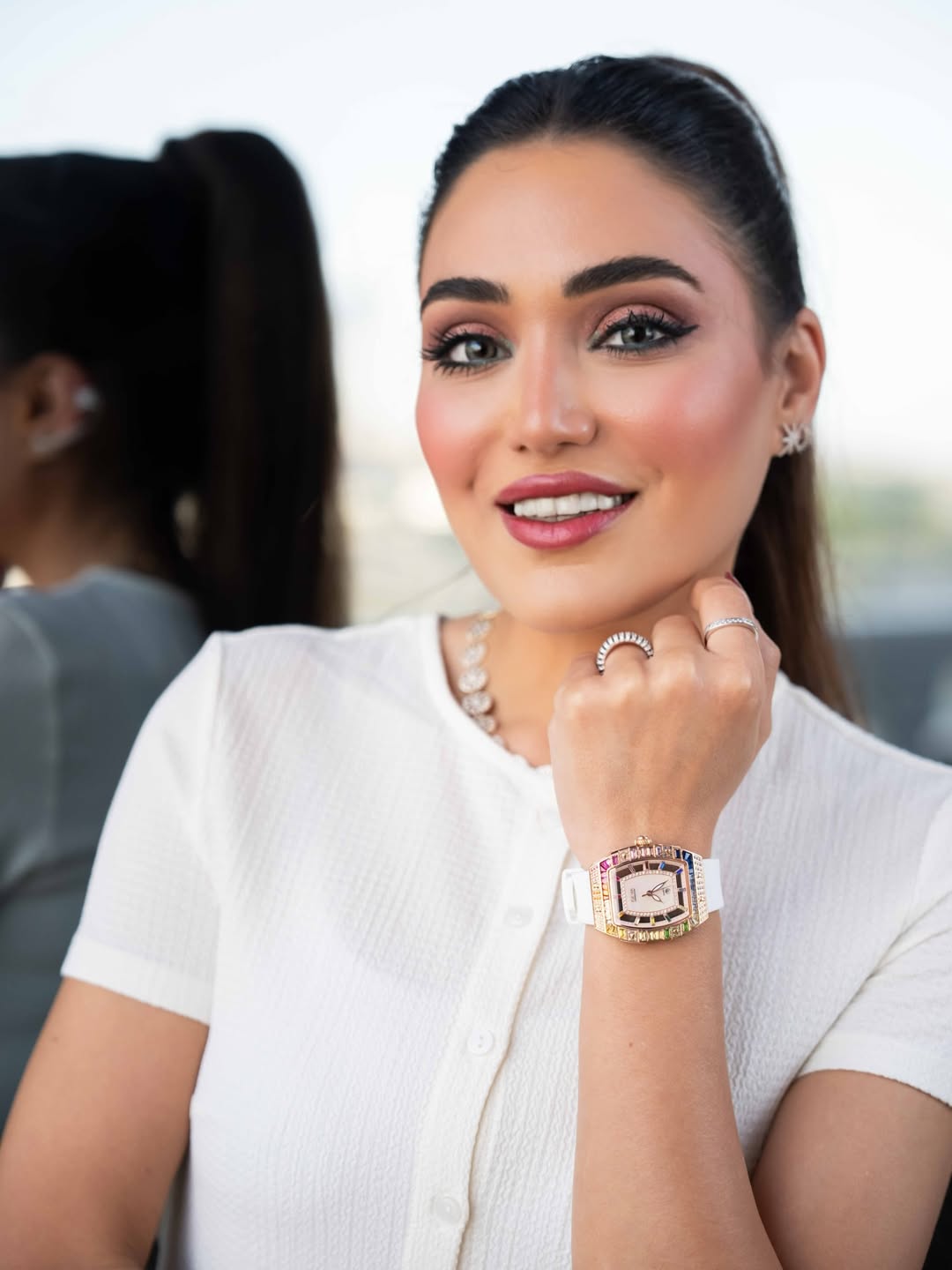 Nannu Magdy wearing a GEYA watch with a white top