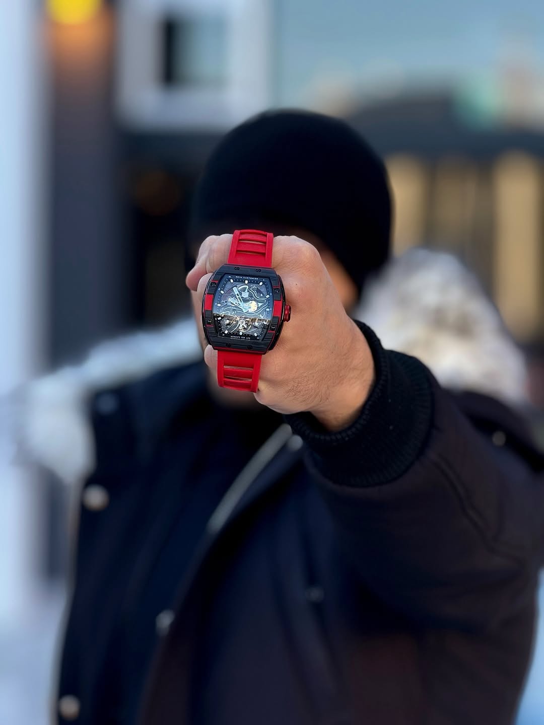 Ale Caccio showing a GEYA watch with a red strap